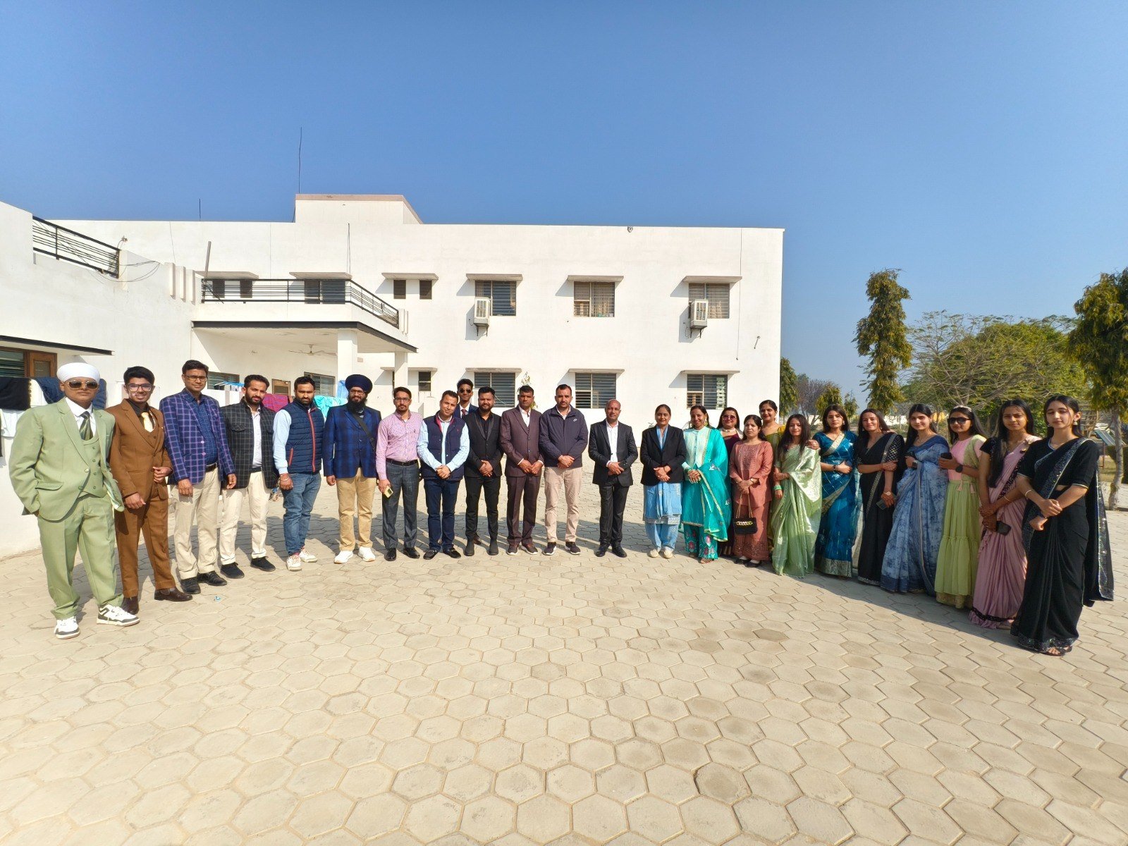 Students and staff outside the school