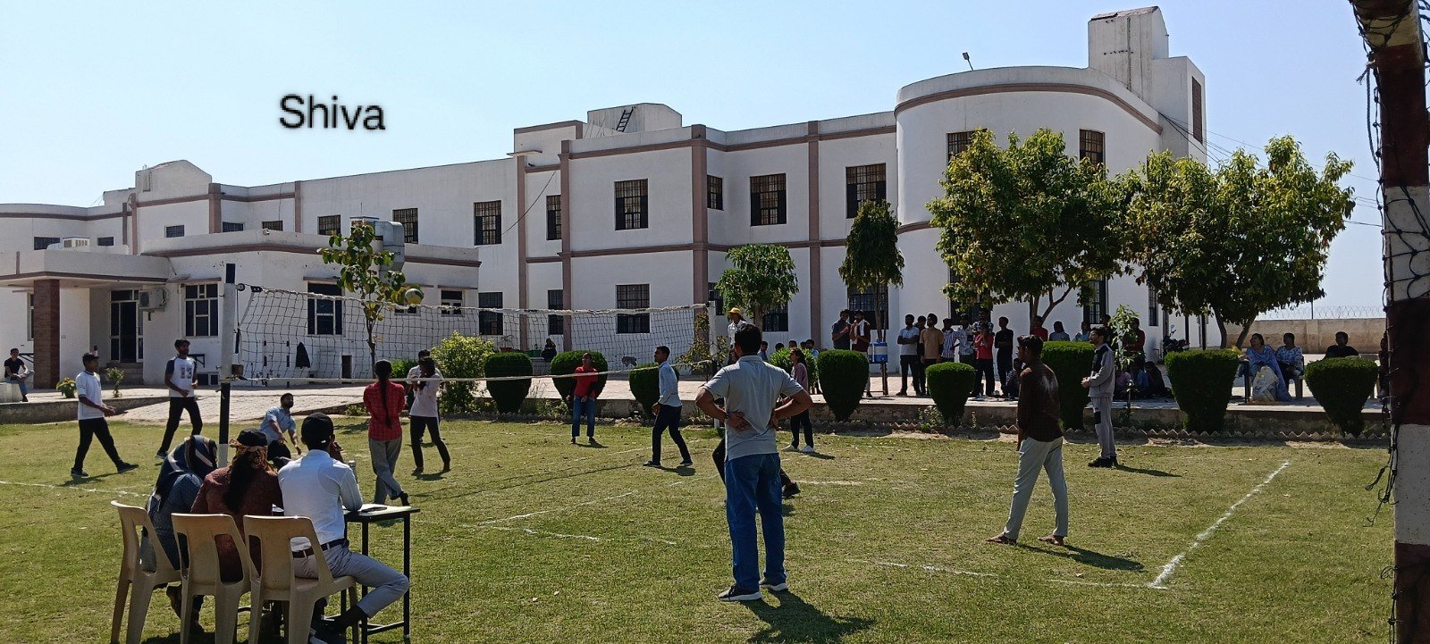 Students on the lawn outside Shiva Children's Academy